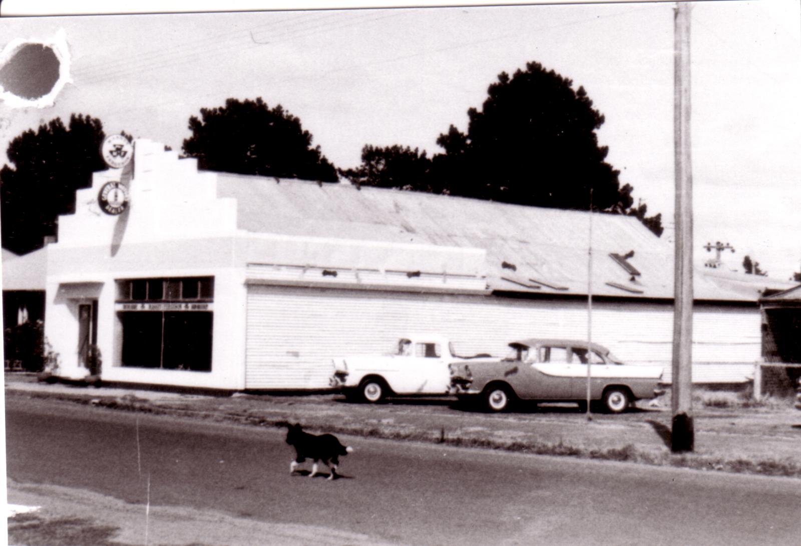  Cranbrook Motors building with two holden vehicles parked out front.