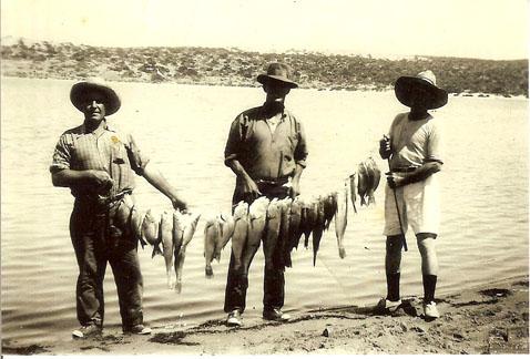 Three men at the Greenough River Mouth.