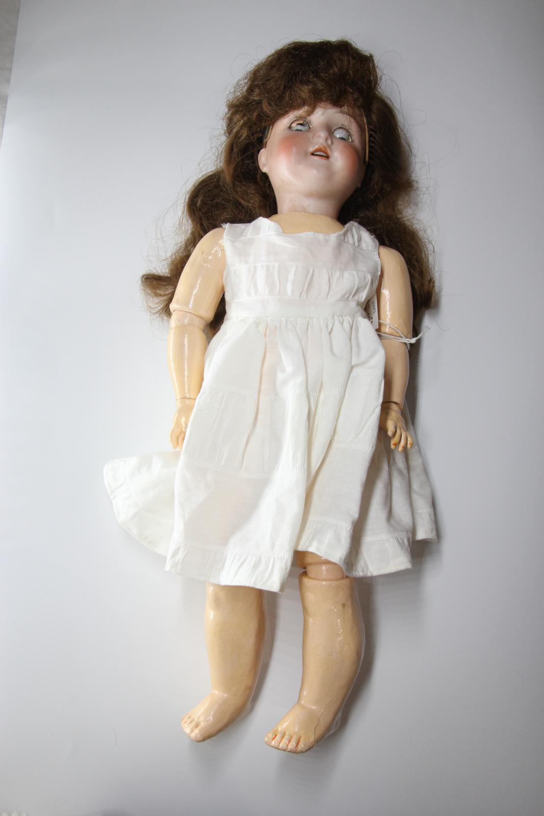 Doll in white dress