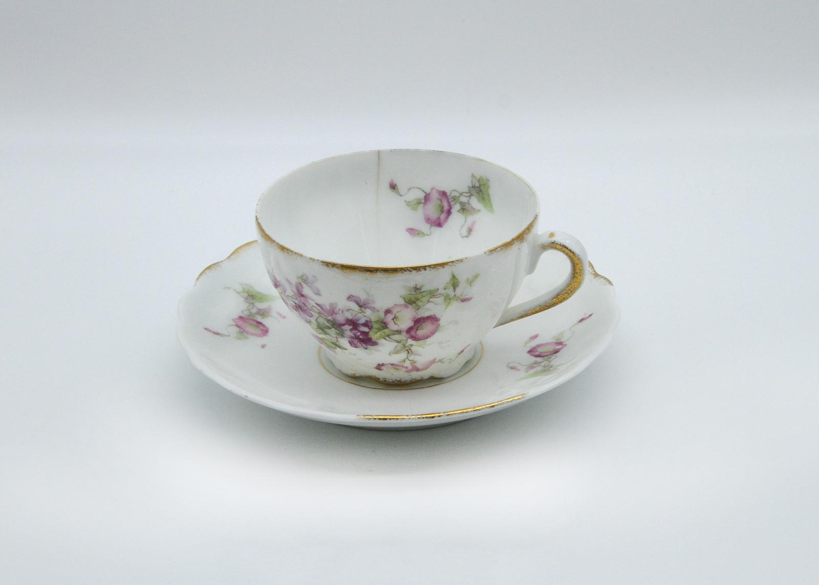 cup and saucer with pink floral design