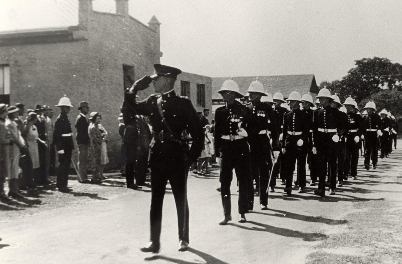 Troops in uniform marching past reviewing stand Anzac Day Rottnest 1938