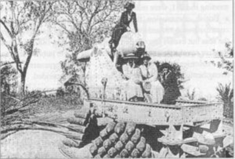 Two women seated on the Bottle Gun carriage in 1930s