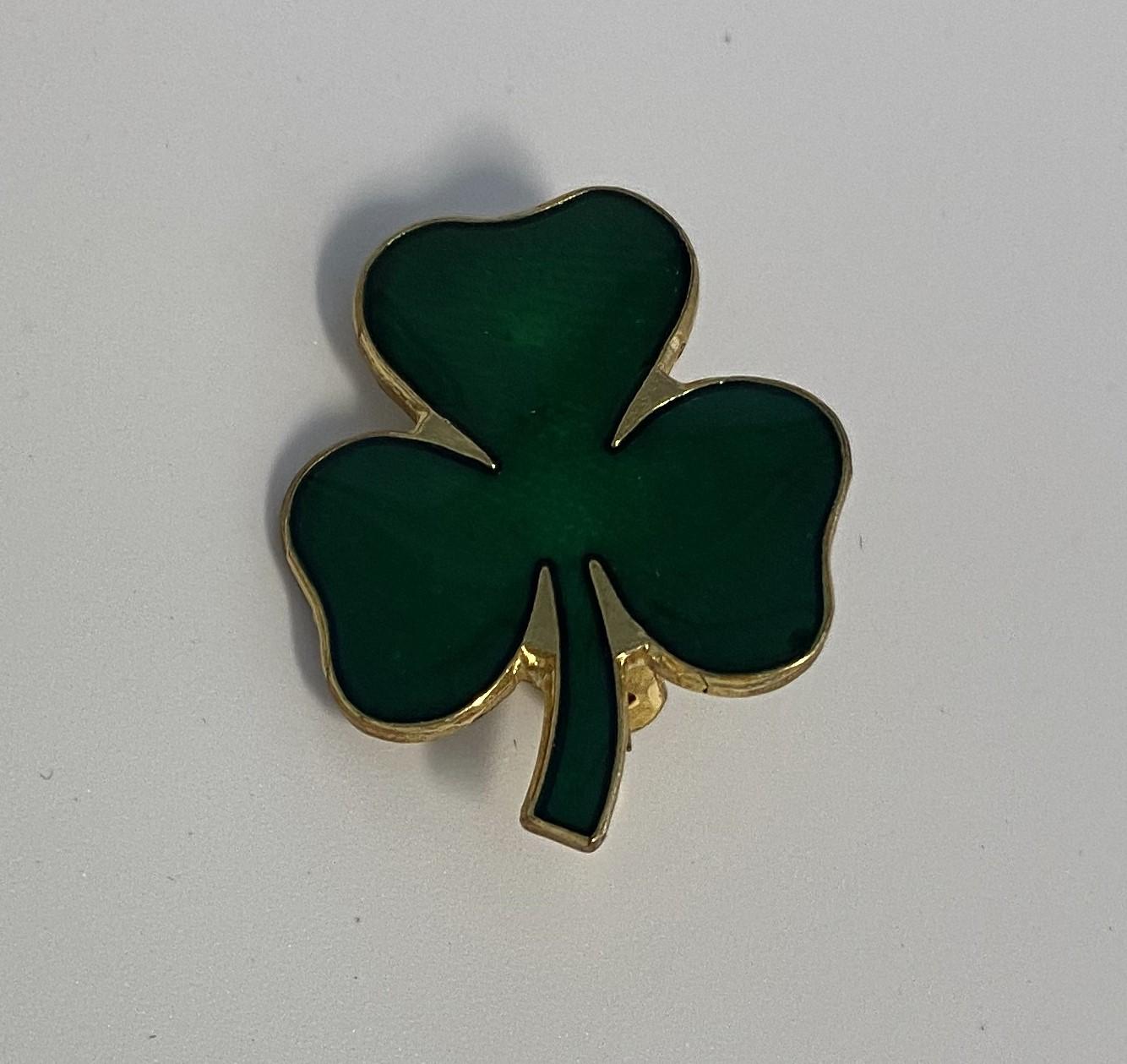 Green clover leaf badge