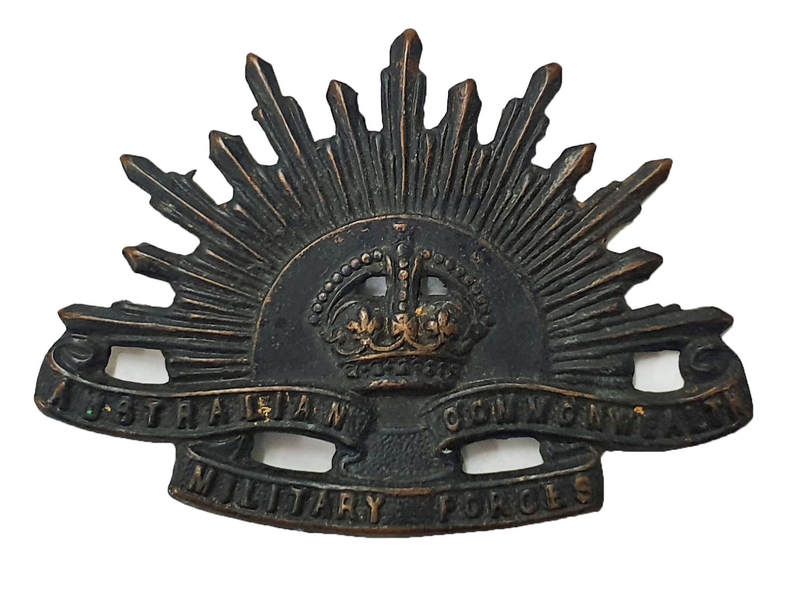 Rising Sun hat badge, oxidised