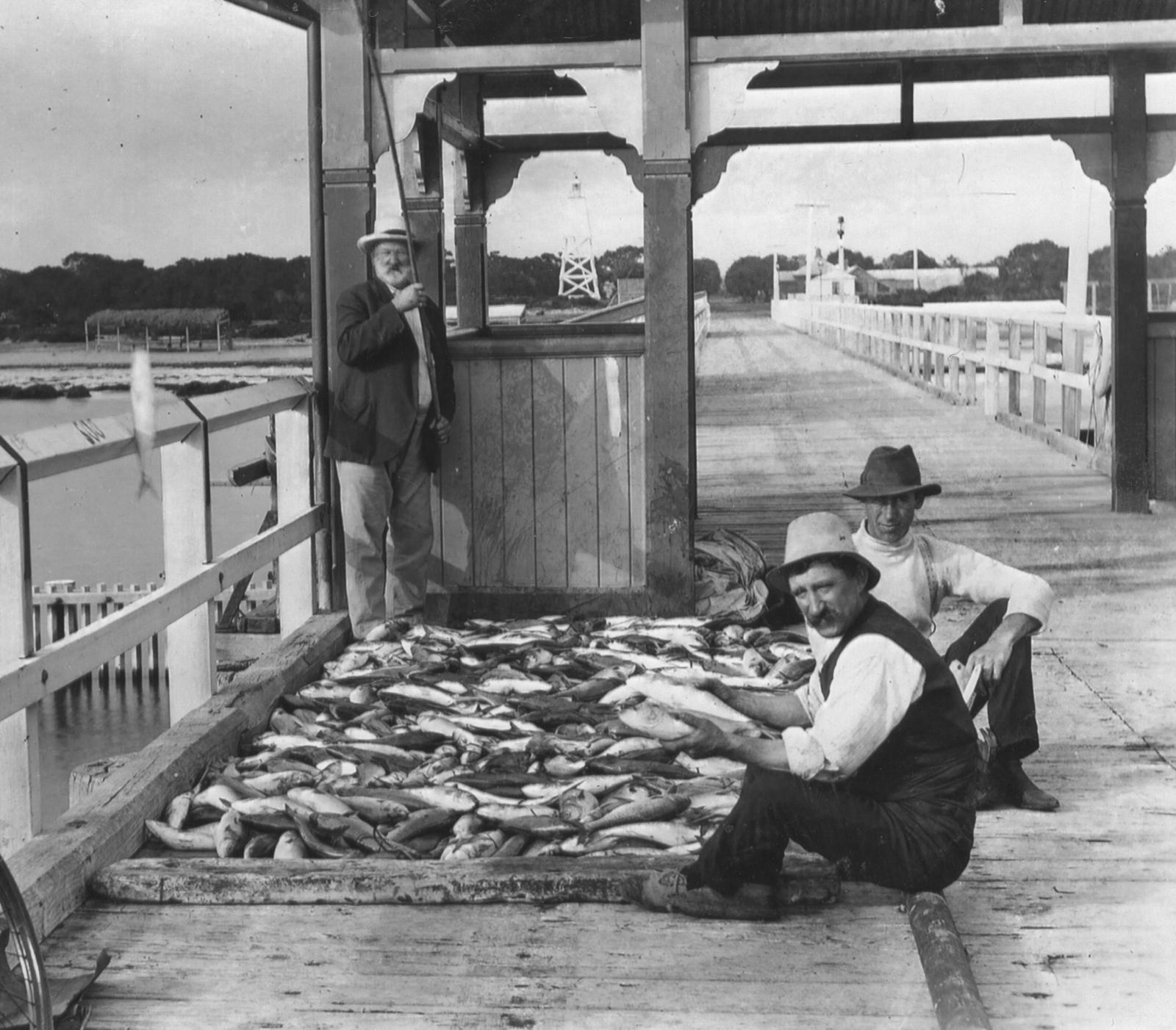 Men with fish in the original Jetty Paviliion