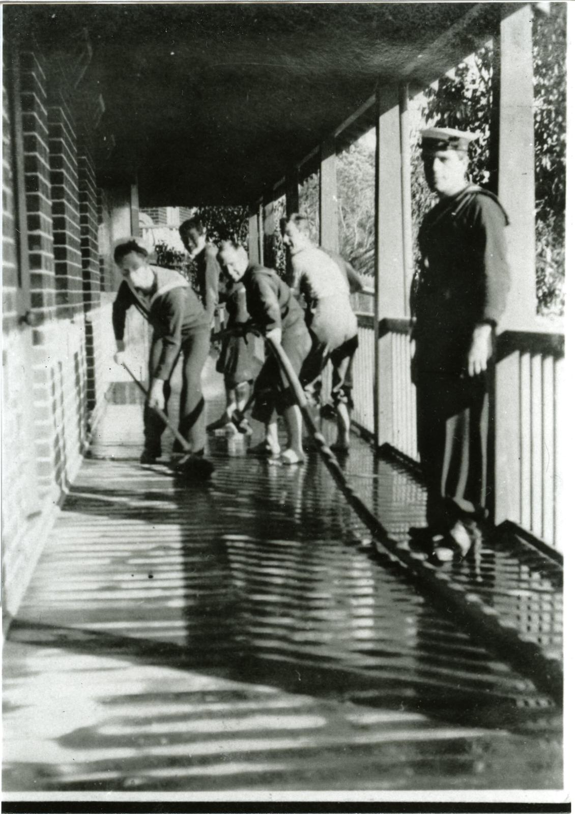 sailors mopping deck