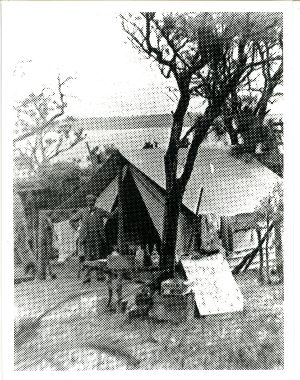 photograph of man camping