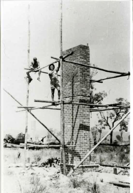 two builders on scaffolding