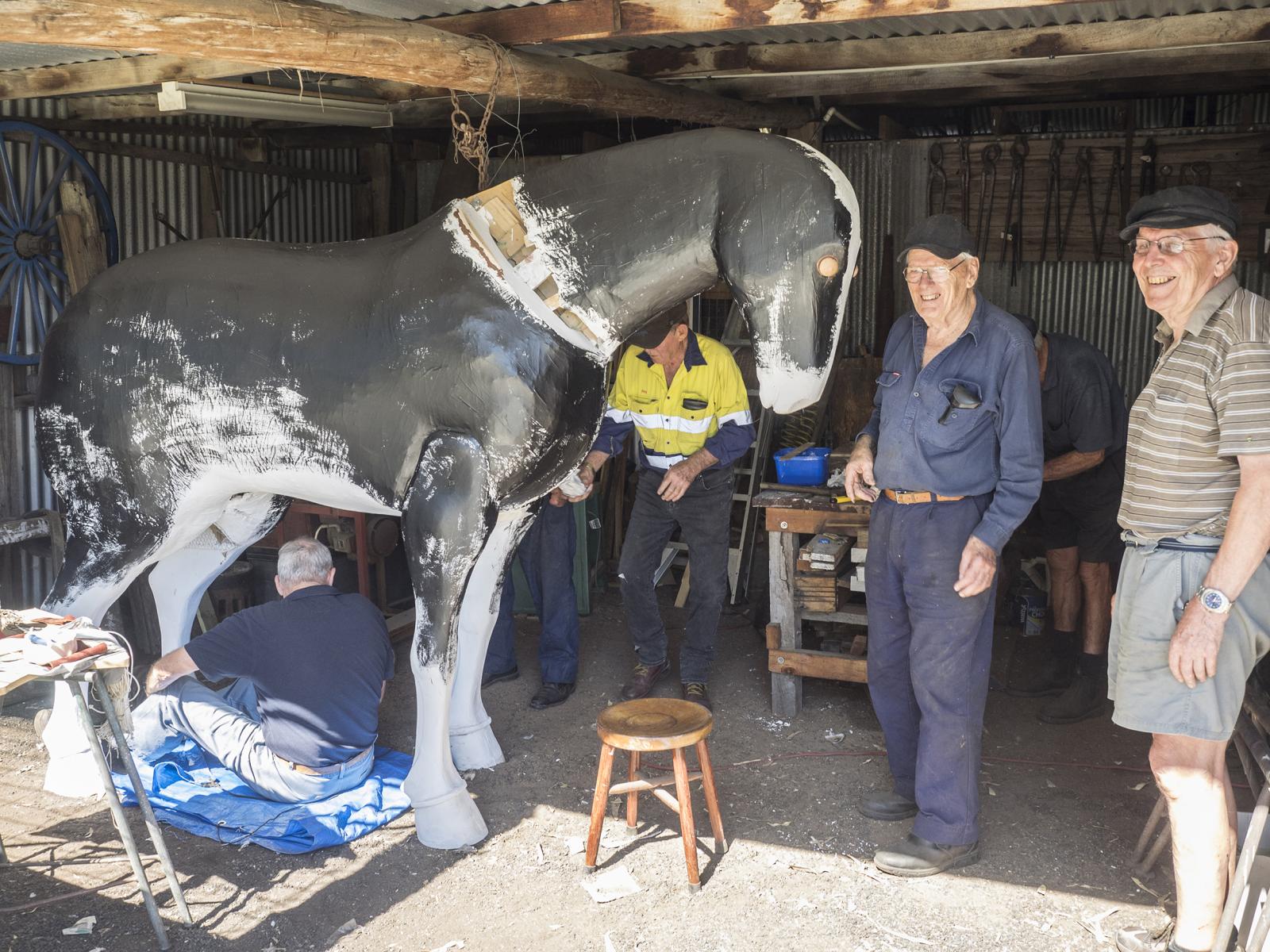 Malcolm Paine (2nd from right) and other BHS members working on the model horse