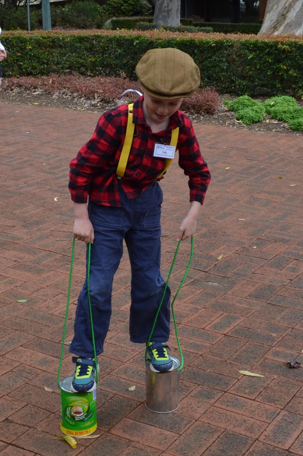 Practicing balancing skills on homemade stilts