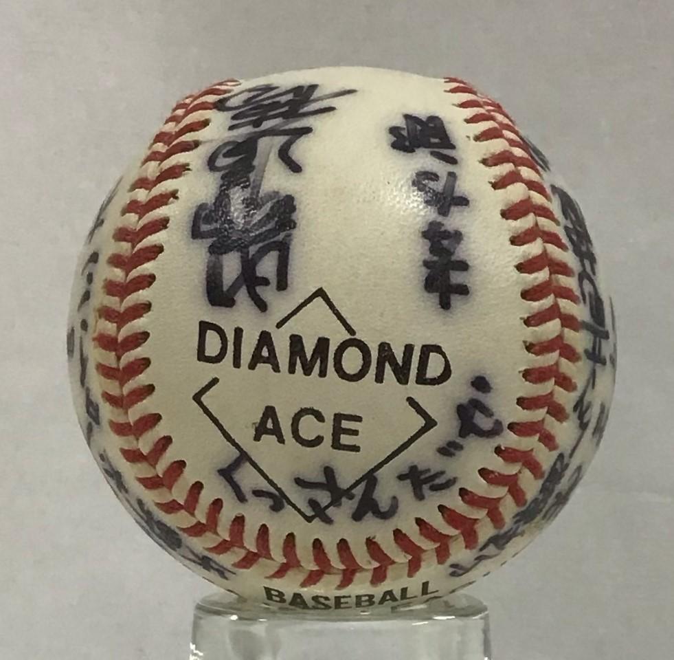 Baseball signed by a Japanese team