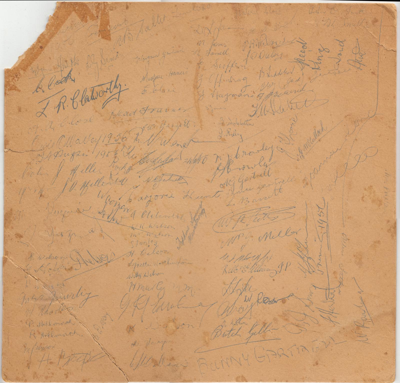 Rear of mounted image featuring signatures of individual players. 