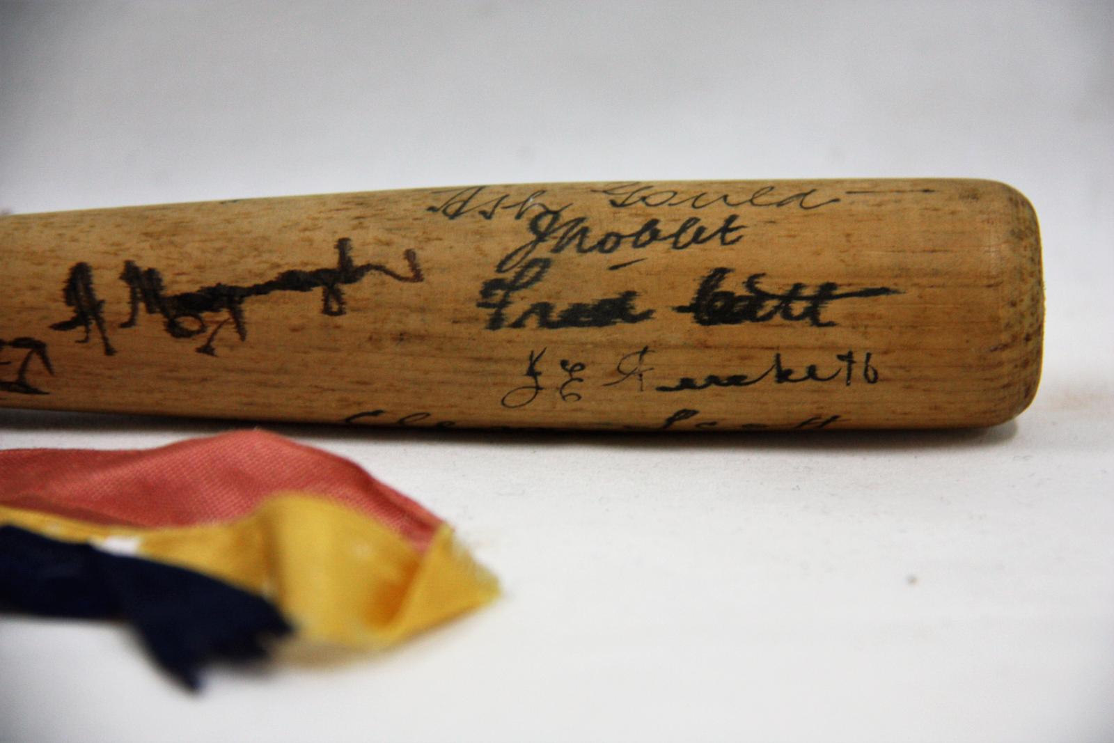 Miniature baseball bat signed by the 1939 South Australian State Team.