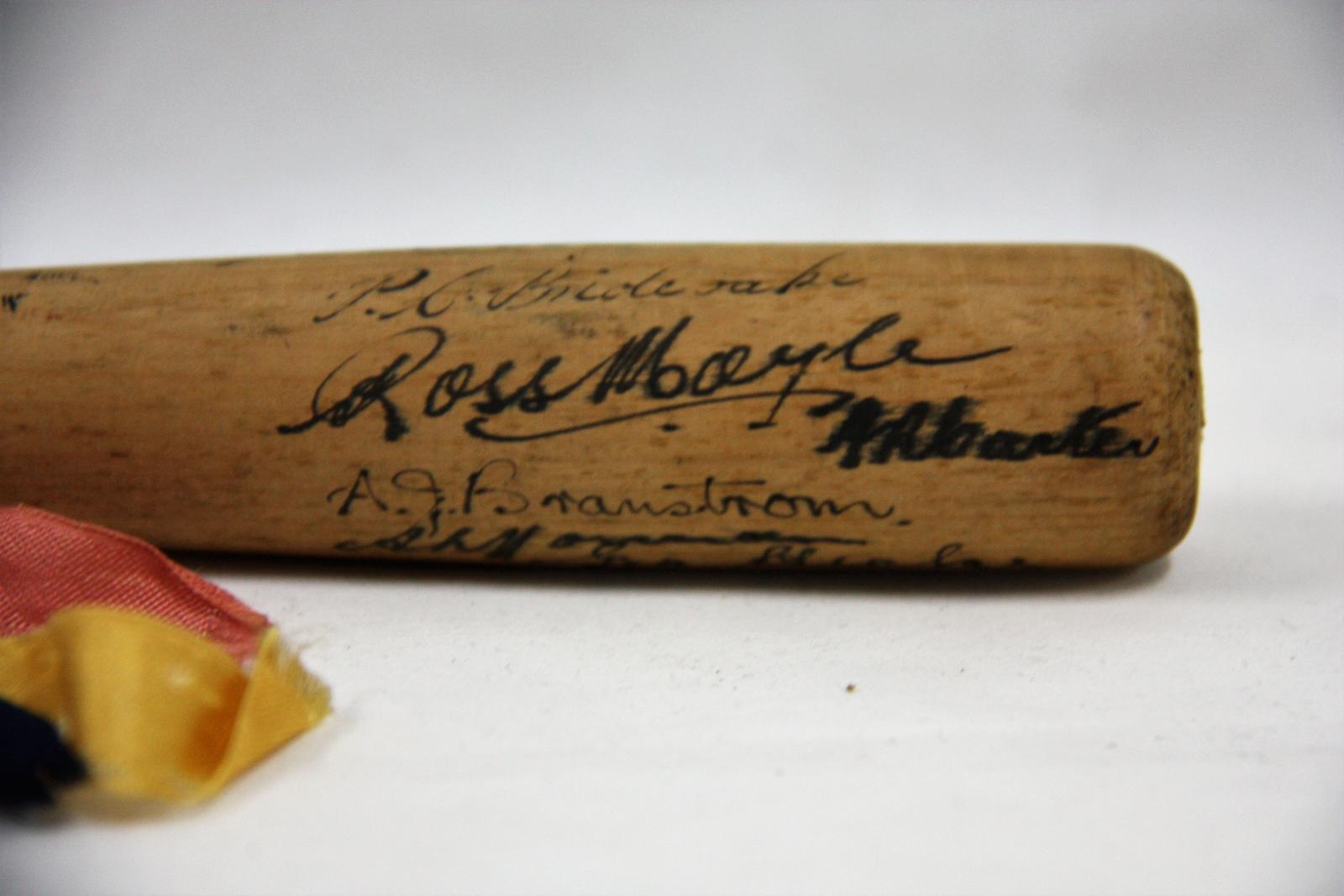 Miniature baseball bat signed by the 1939 South Australian State Team.