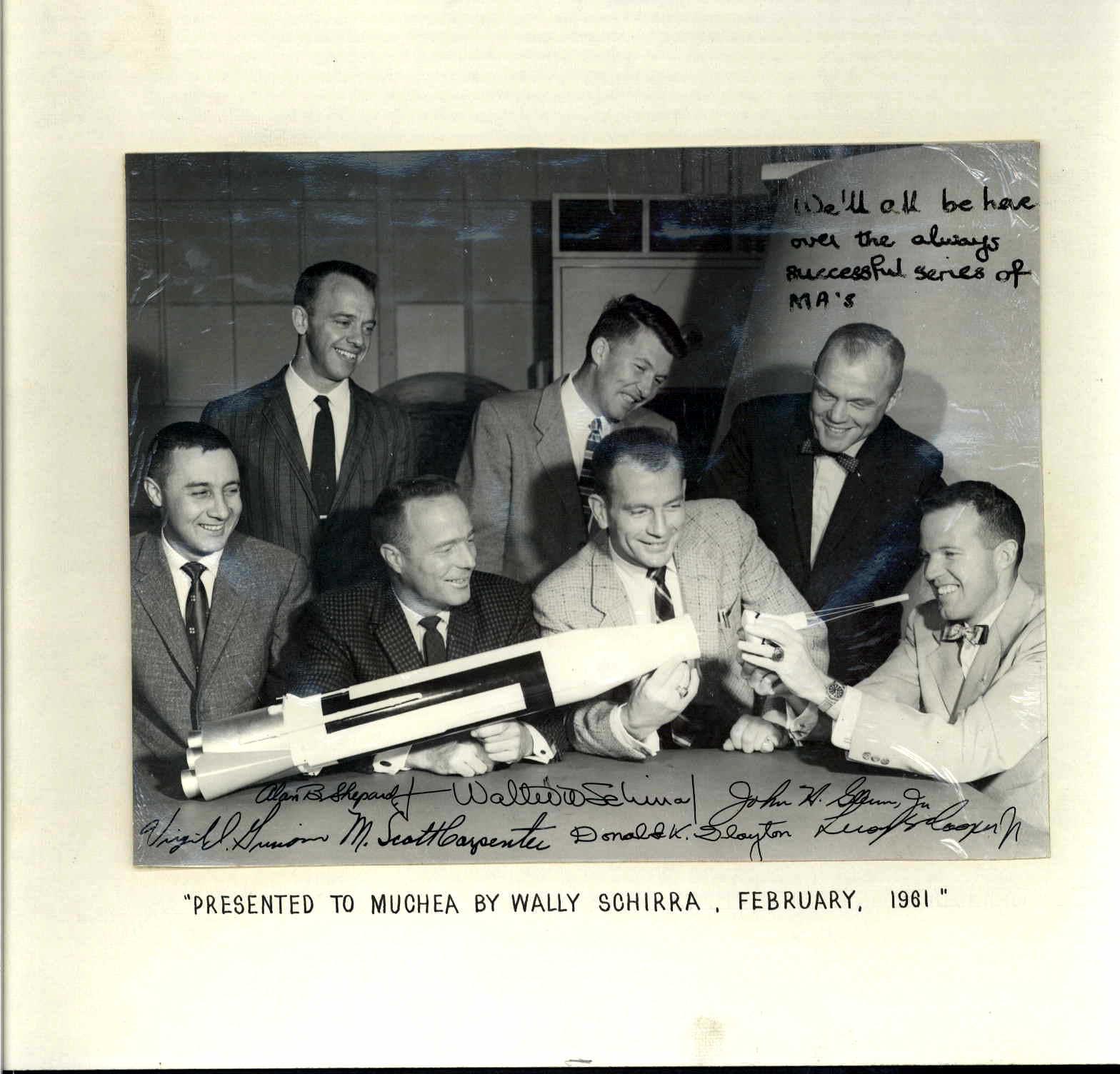 Mounted black and white photograph of Mercury 7 astronauts. Photograph has been signed by all 7 astronauts