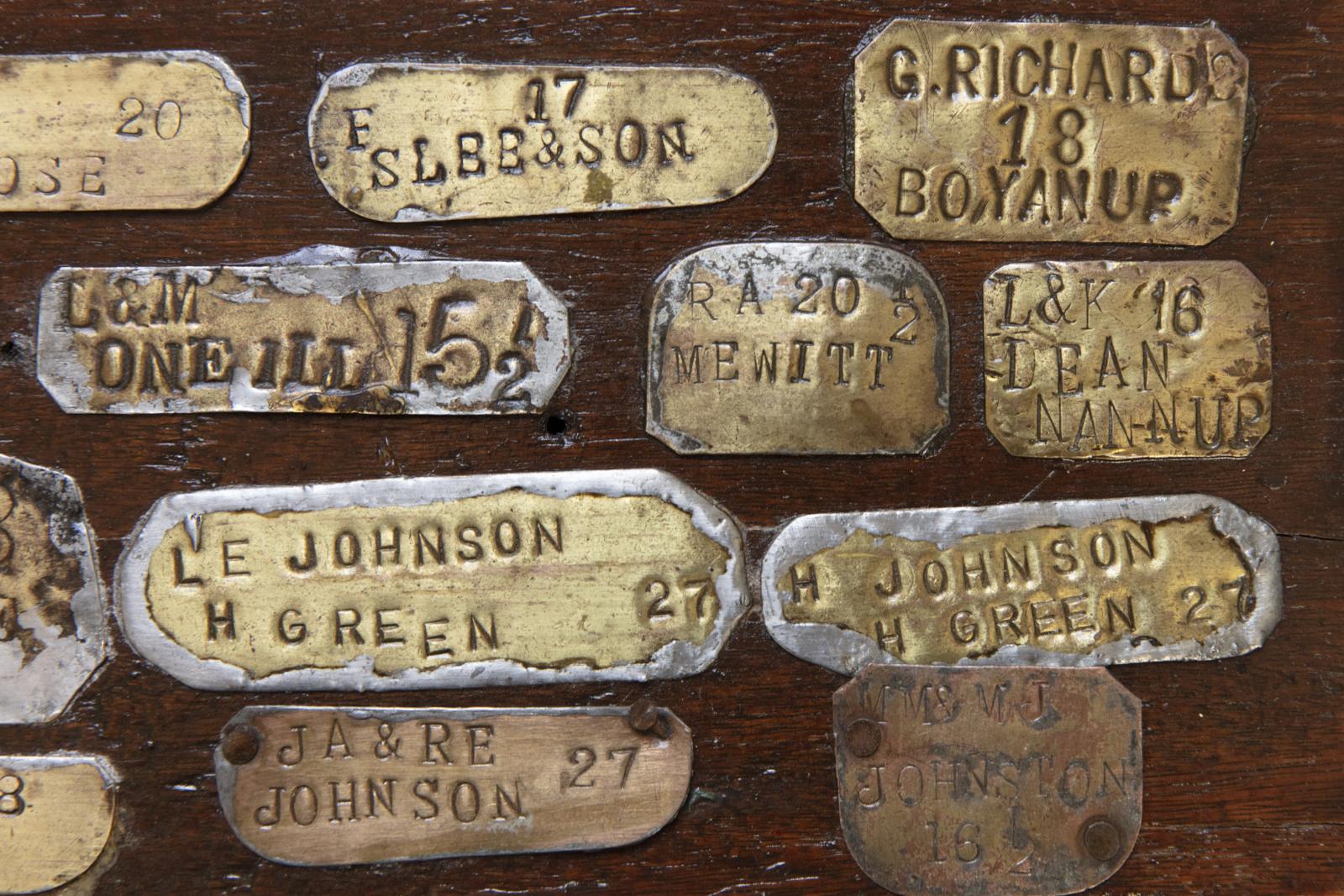 Selection of brass labels that were soldered onto Cream Cans