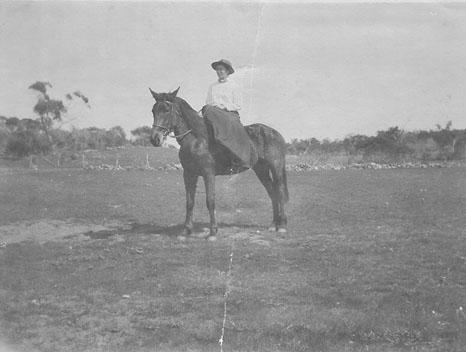 Black & white photograph of Ivy Morrell riding side-saddle