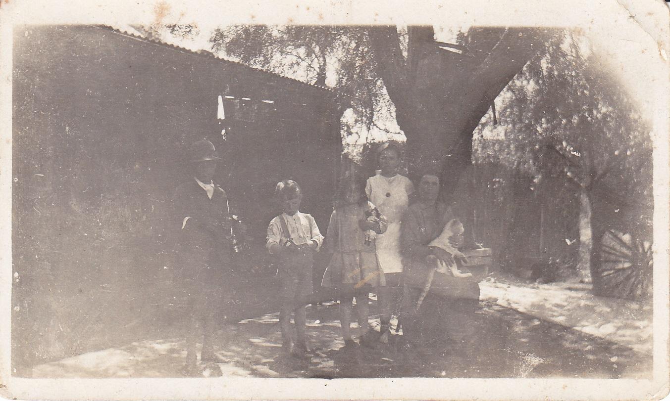 Family in the garden at Hillview Farm, South Greenough