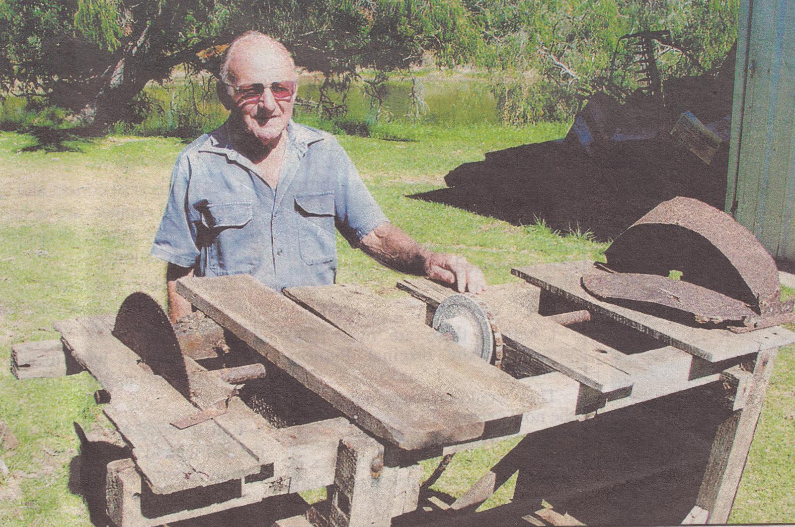 BHS member George Reynolds and unrestored Salmon Bench at the Museum