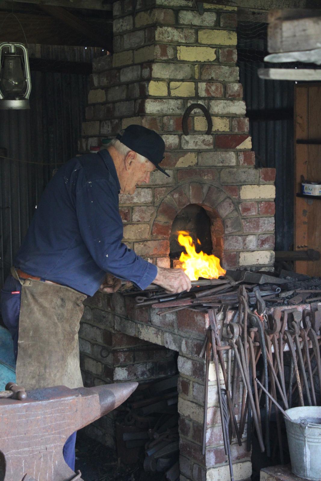 Malcom Paine working the Forge in the Blacksmiths Shop