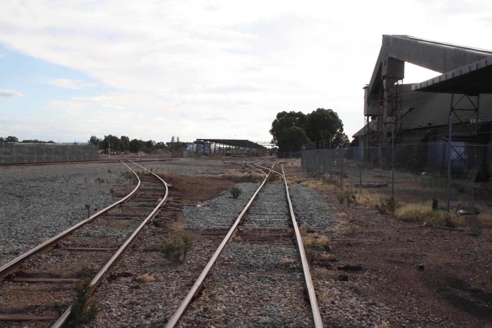 P34-36. Exterior yard and rail line at the silo. 