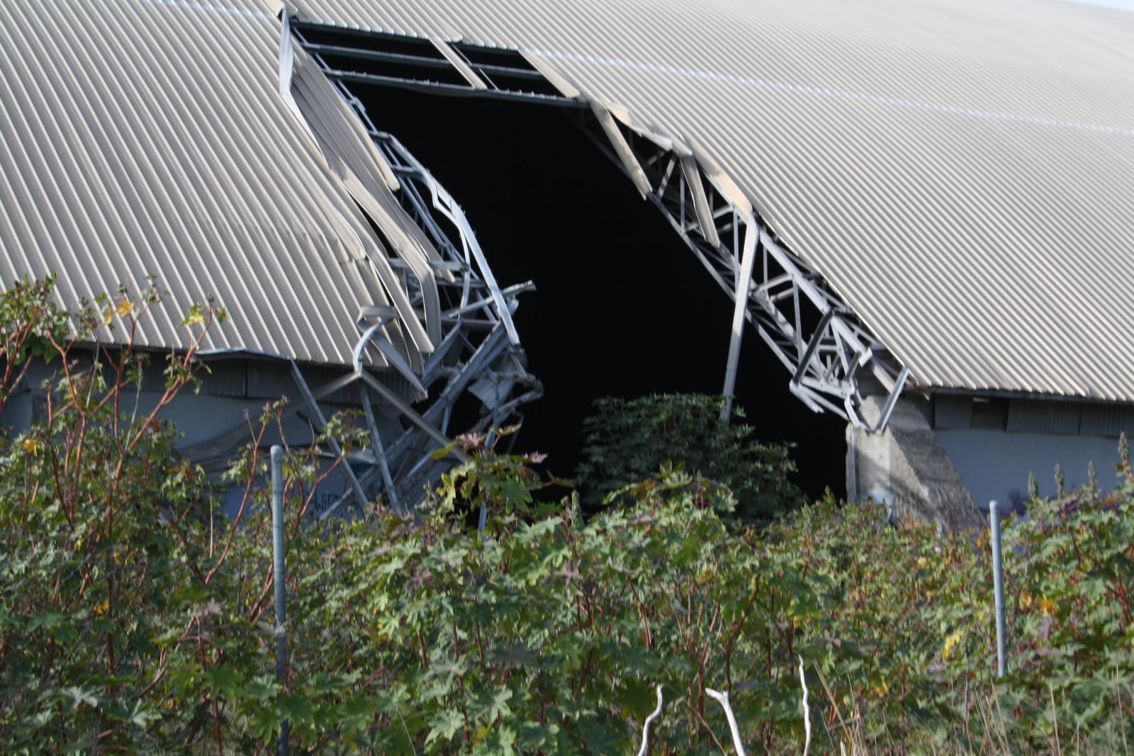 P34-39. Exterior of the silo. The first demolition strike on the silo. Demolition was temporarily halted due to public objections about the demolition. 