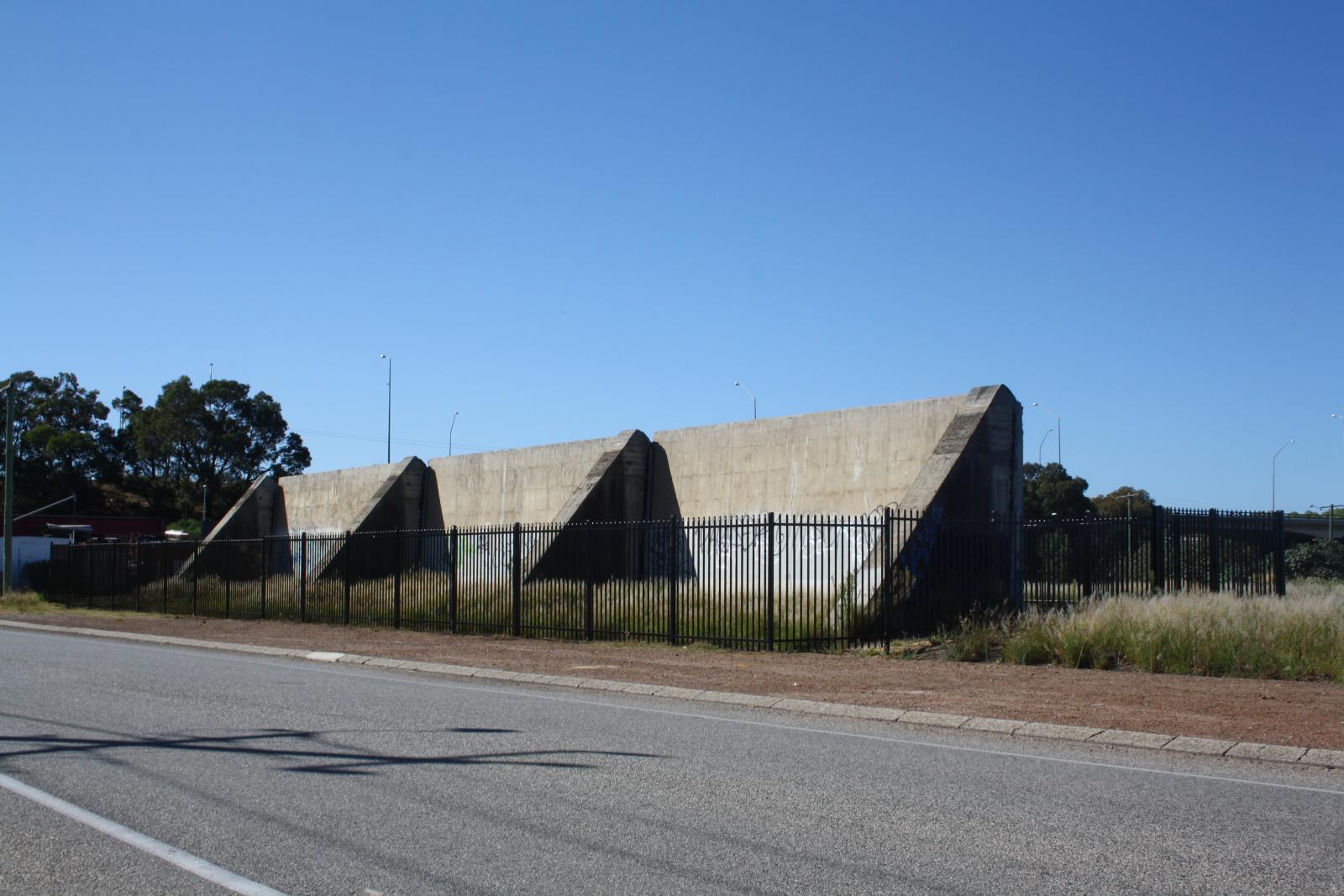 P34-45. Remnant wall which was demolished three years later. 