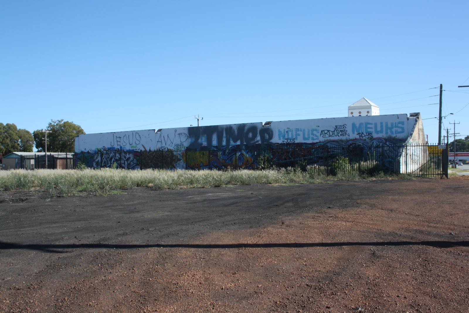 P34-47. Remnant wall which was demolished three years later. 