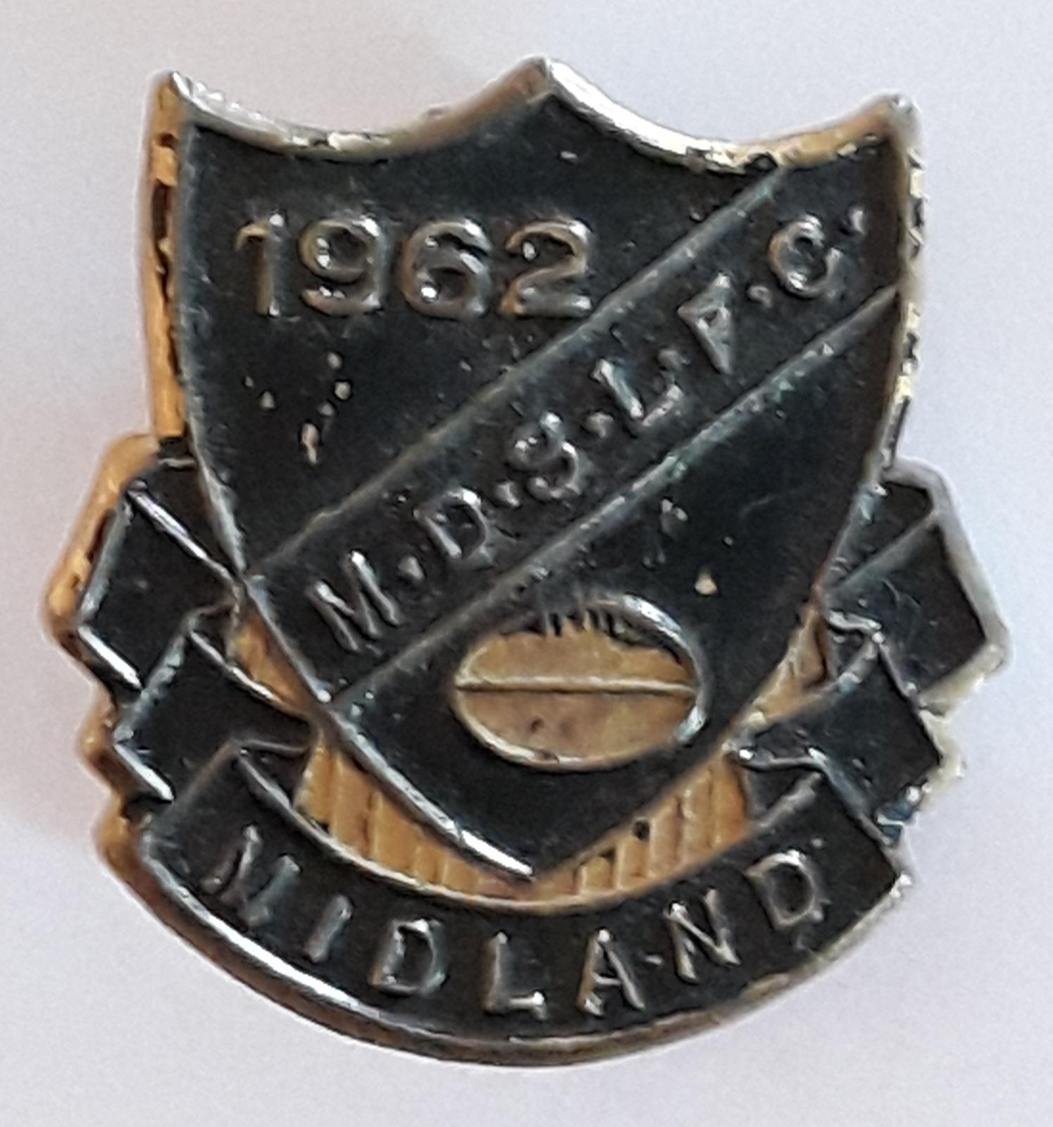 Midland District Sunday League Football Club 1962. Shield-shaped badge in black and gold. 