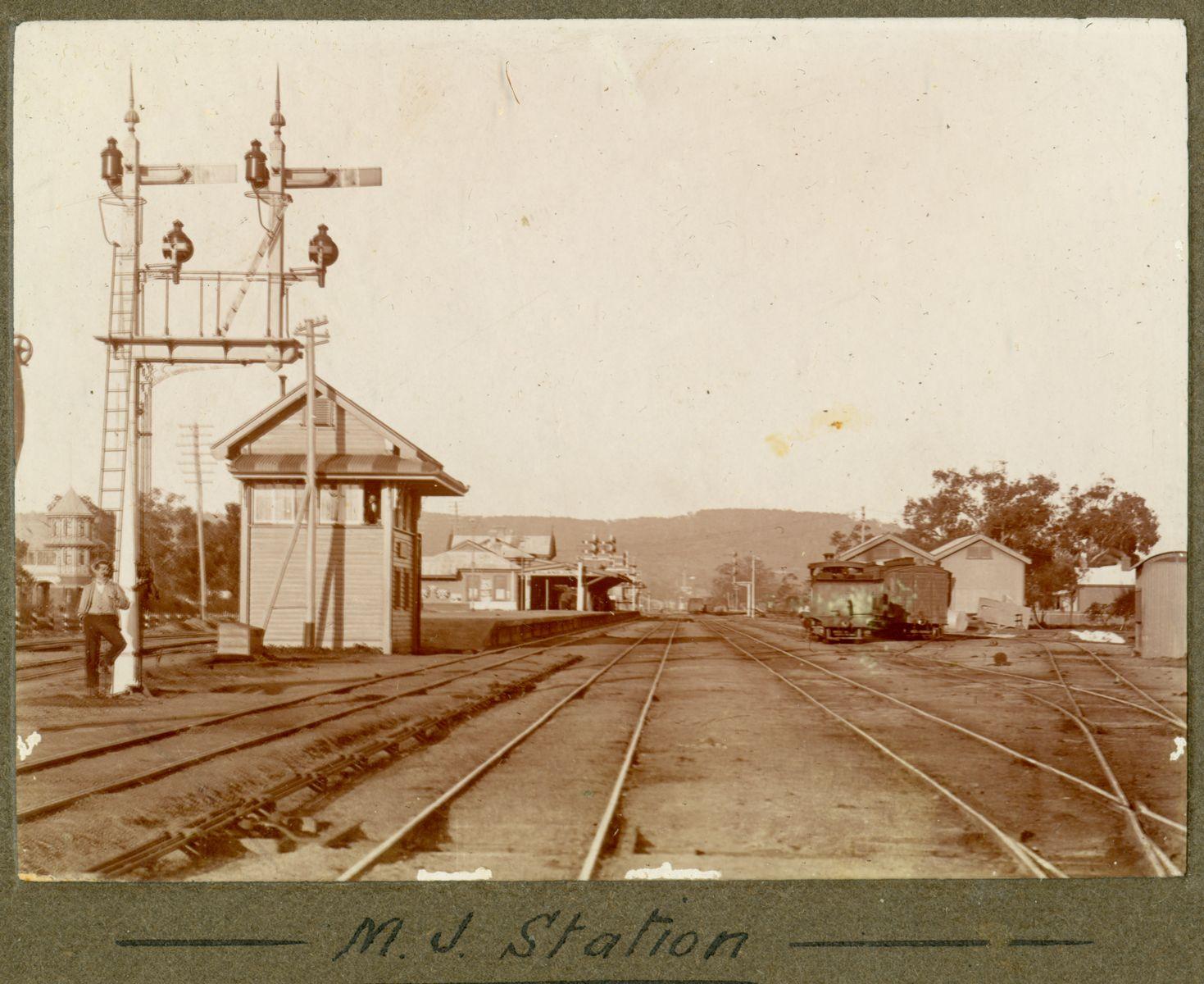 P100-08. Midland Junction Railway Station viewed from the railway line to the west and looking east to the Perth hills. The Helena Vale Hotel can be seen in the background on the left.