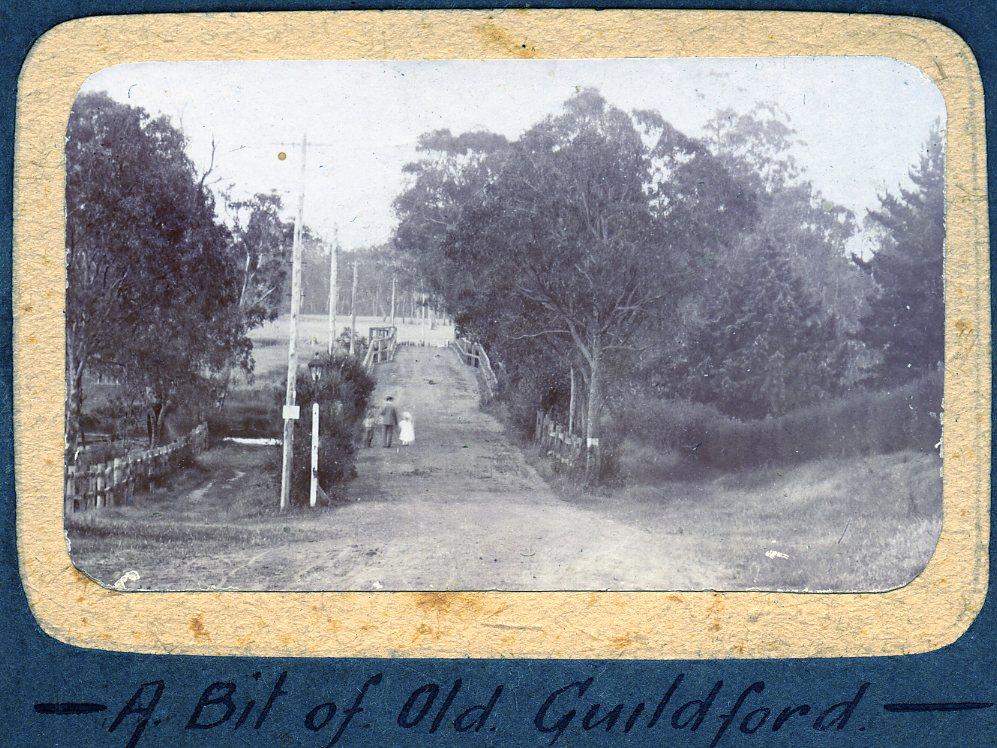 P100-56. An old bridge in Guildford. The road is likely to be the Guildford-Perth road and the river the Helena River.