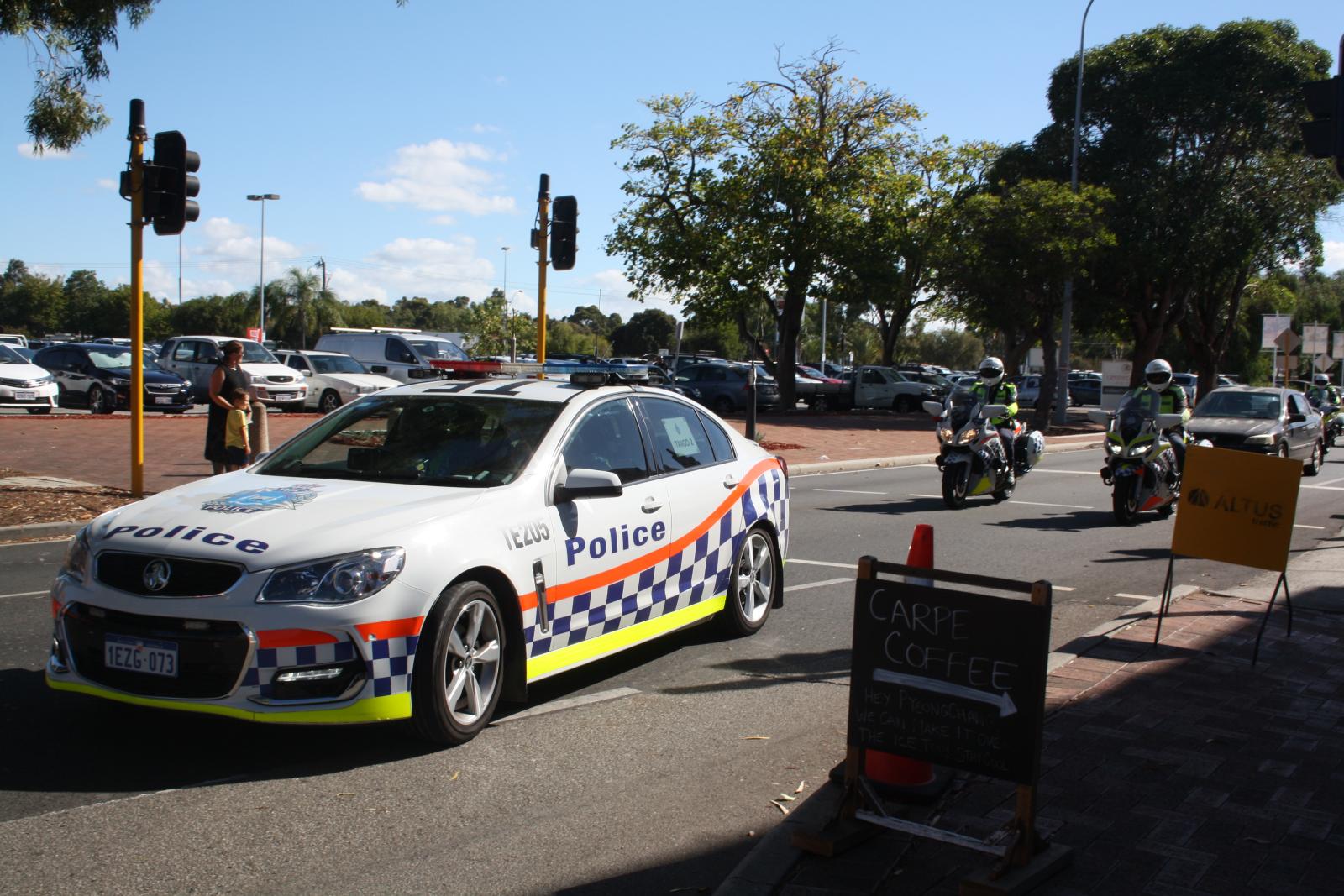 P97-01. Procession carrying relay runners and security arriving in Midland. 