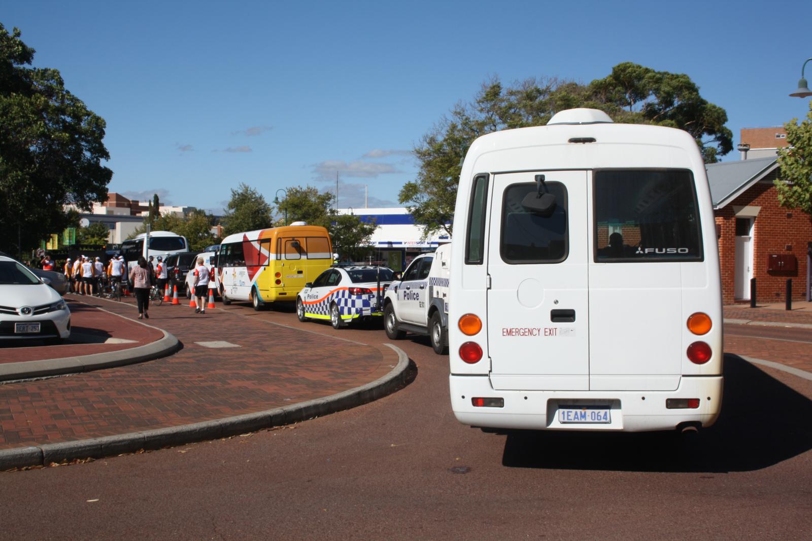 P97-05. Procession carrying relay runners and security arriving in Midland. 