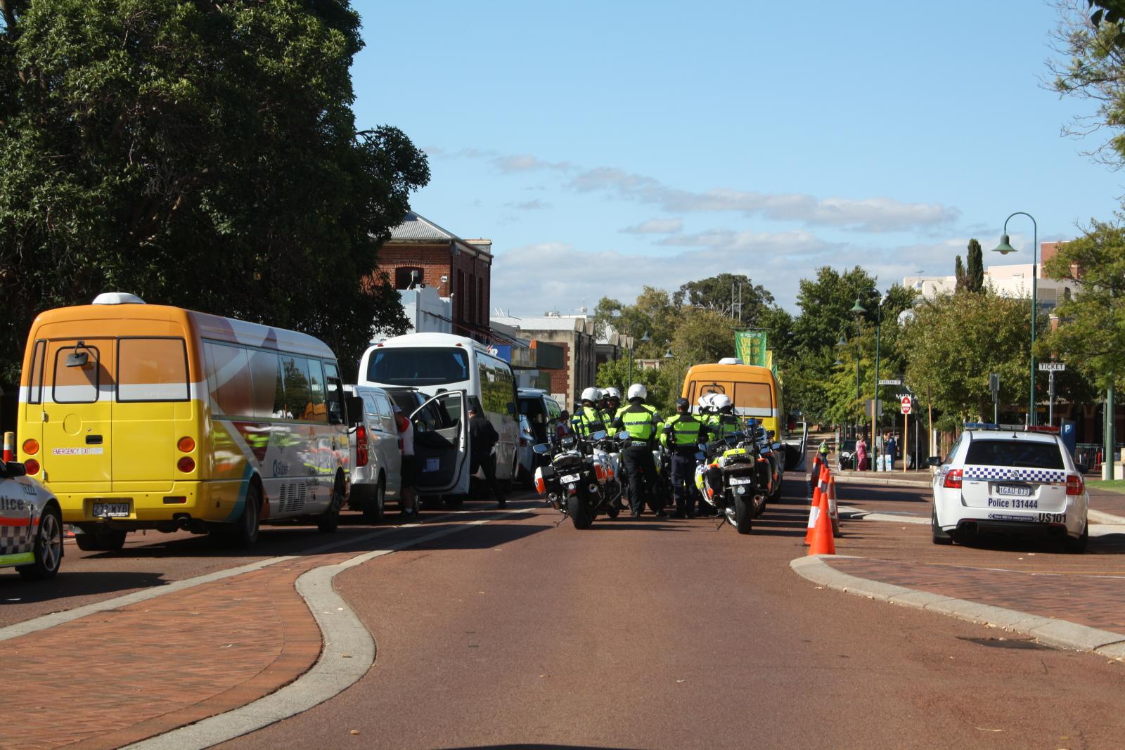 P97-07. Procession carrying relay runners and security arriving in Midland. 