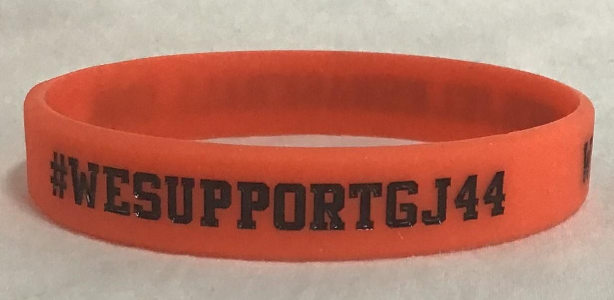 Wrist band - Greg Jelks.