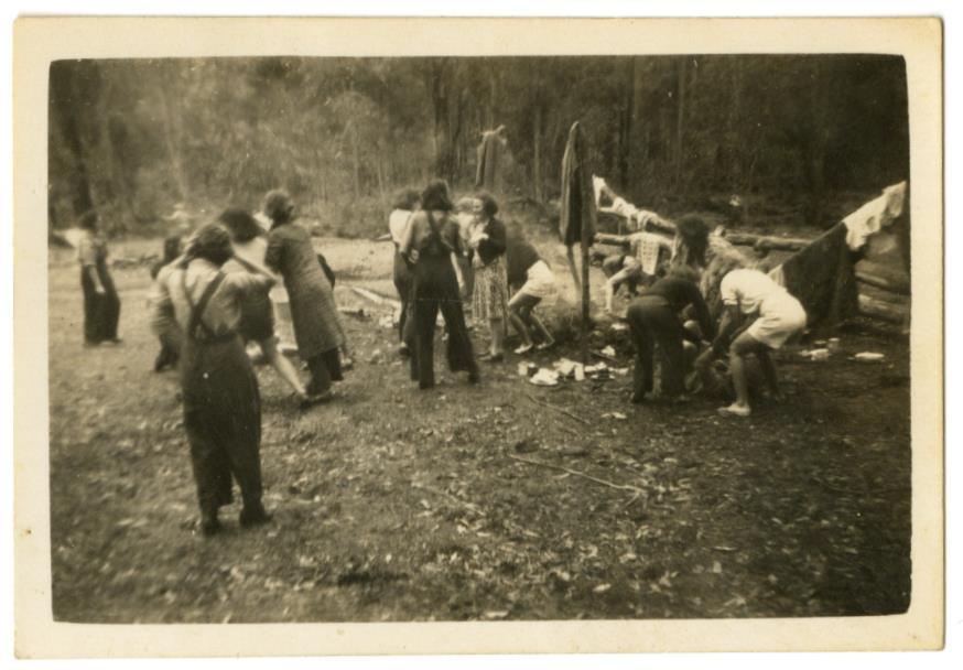 Melee of the members, some in uniform, some in mufti at the camp ground was a very wet November and the members were involved in “Face Charcoaling”.