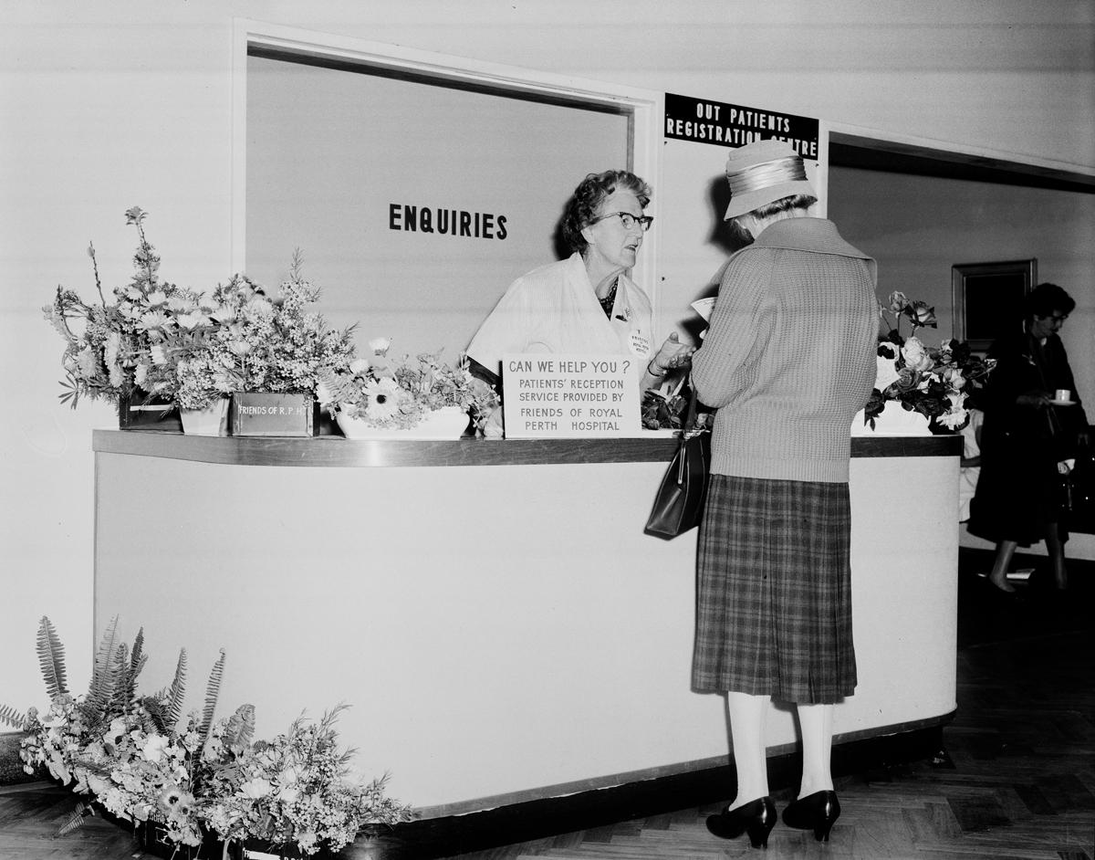 Outpatients Registration Centre, RPH, with flowers at reception desk, 1964