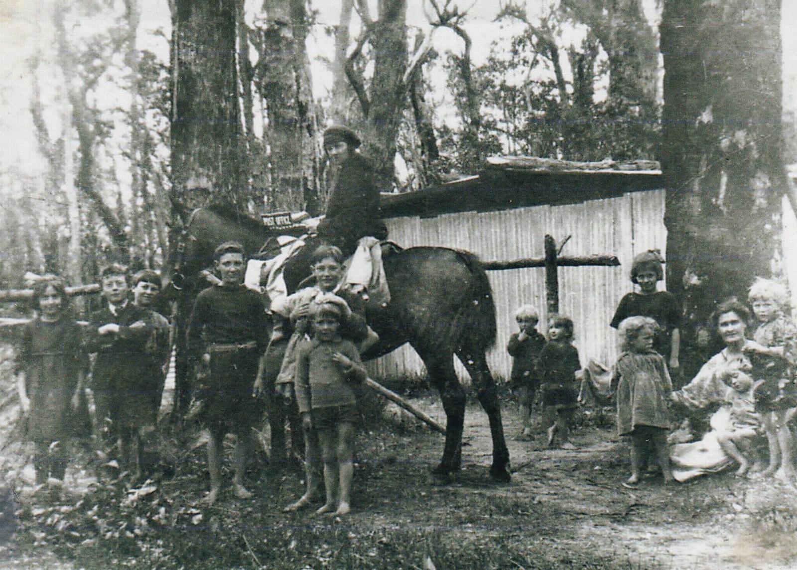 The Postman delivers the mail to families at Group 124 at Chapman Hill c1925