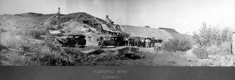 Black and white wide landscape photo of mining activity. 