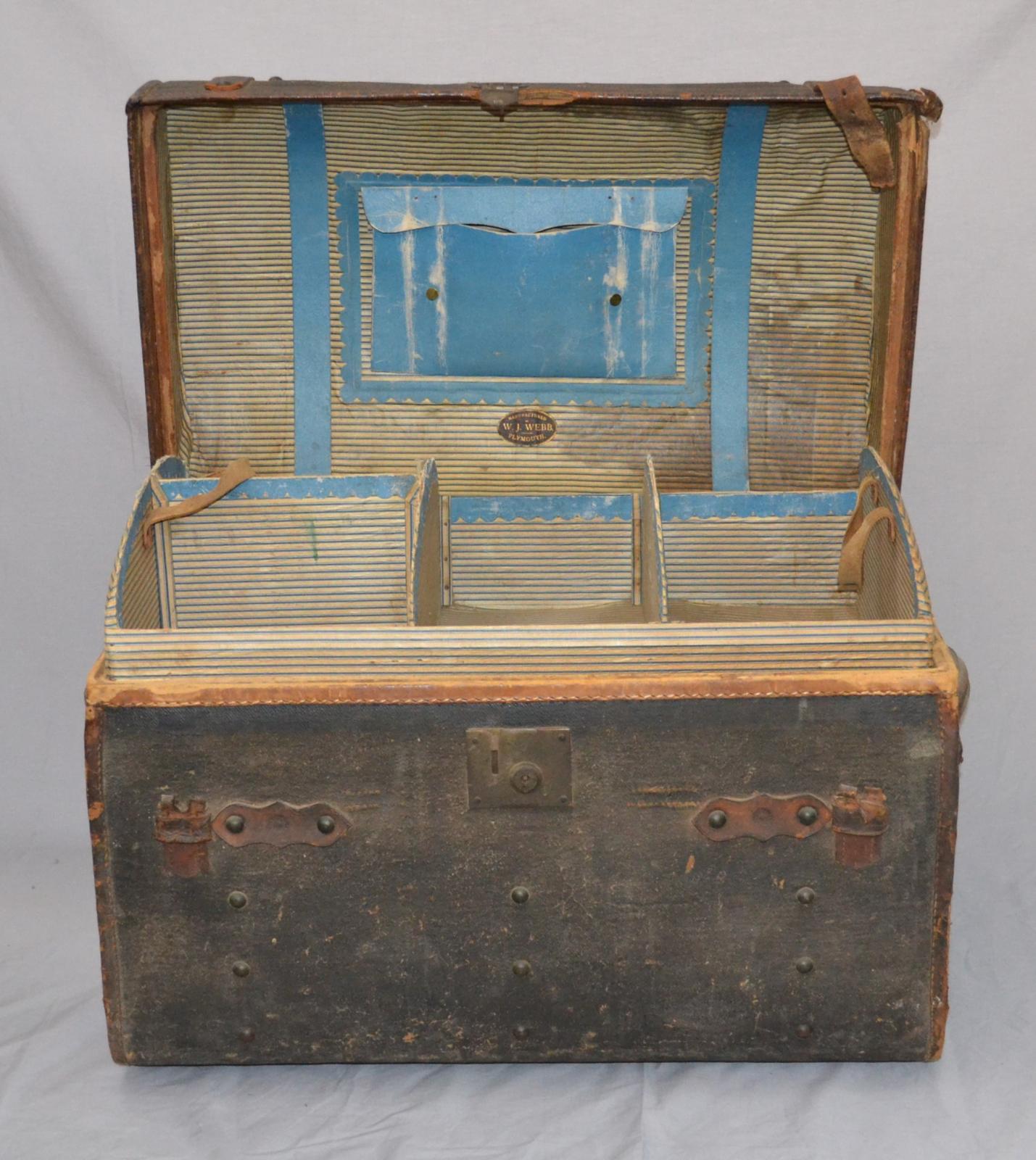 Image of rectangular Saratoga Trunk with the lid open and showing a blue coloured document pouch inside the lid and a removable insert inside the base