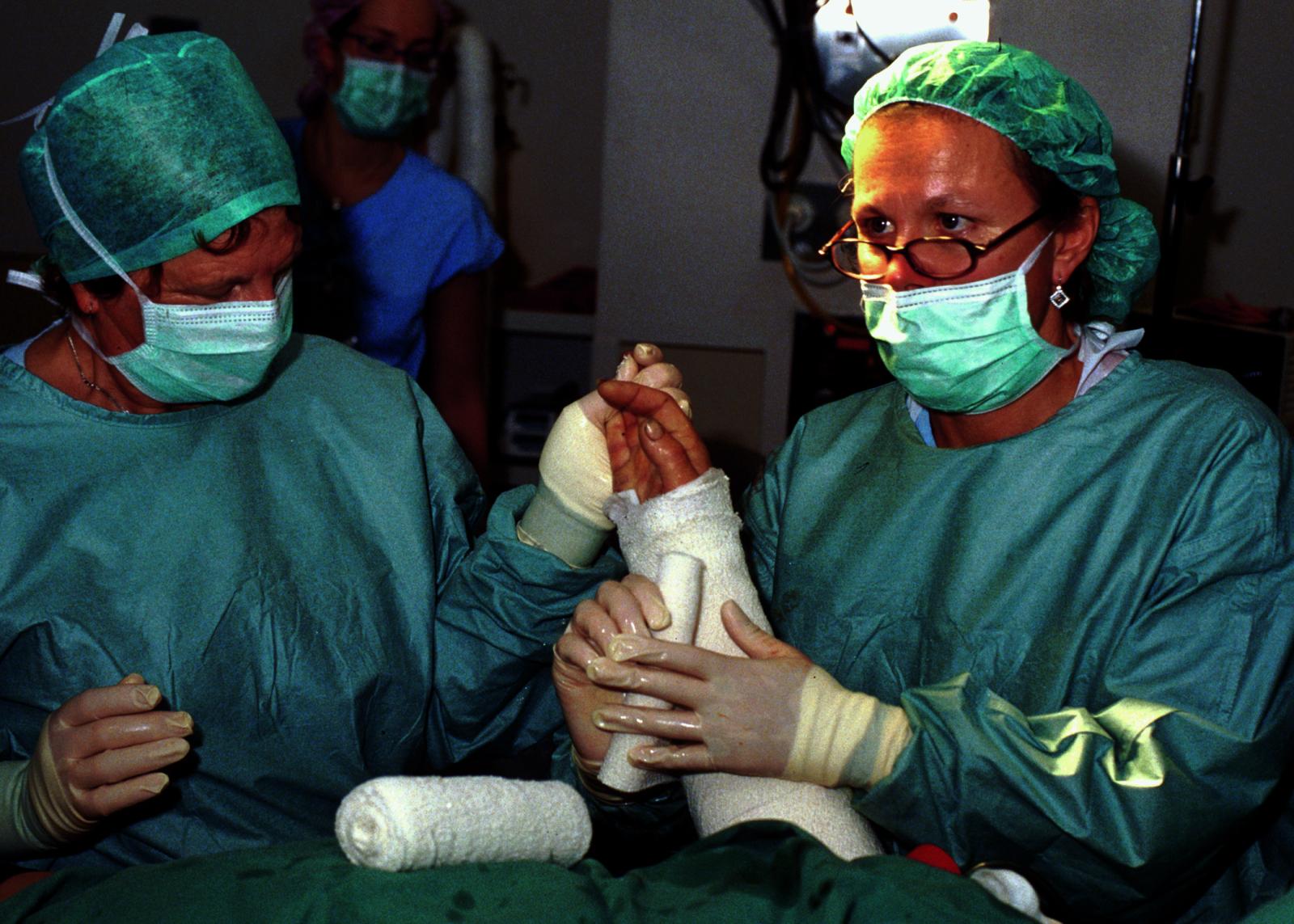 Patricia Dixon, theatre nurse and Burn Unit Director Fiona Wood in heated operating theatre