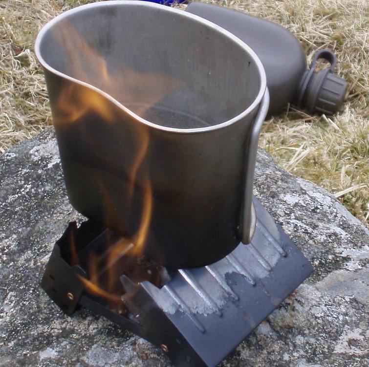 Boiling water in canteen cup on hexamine stove