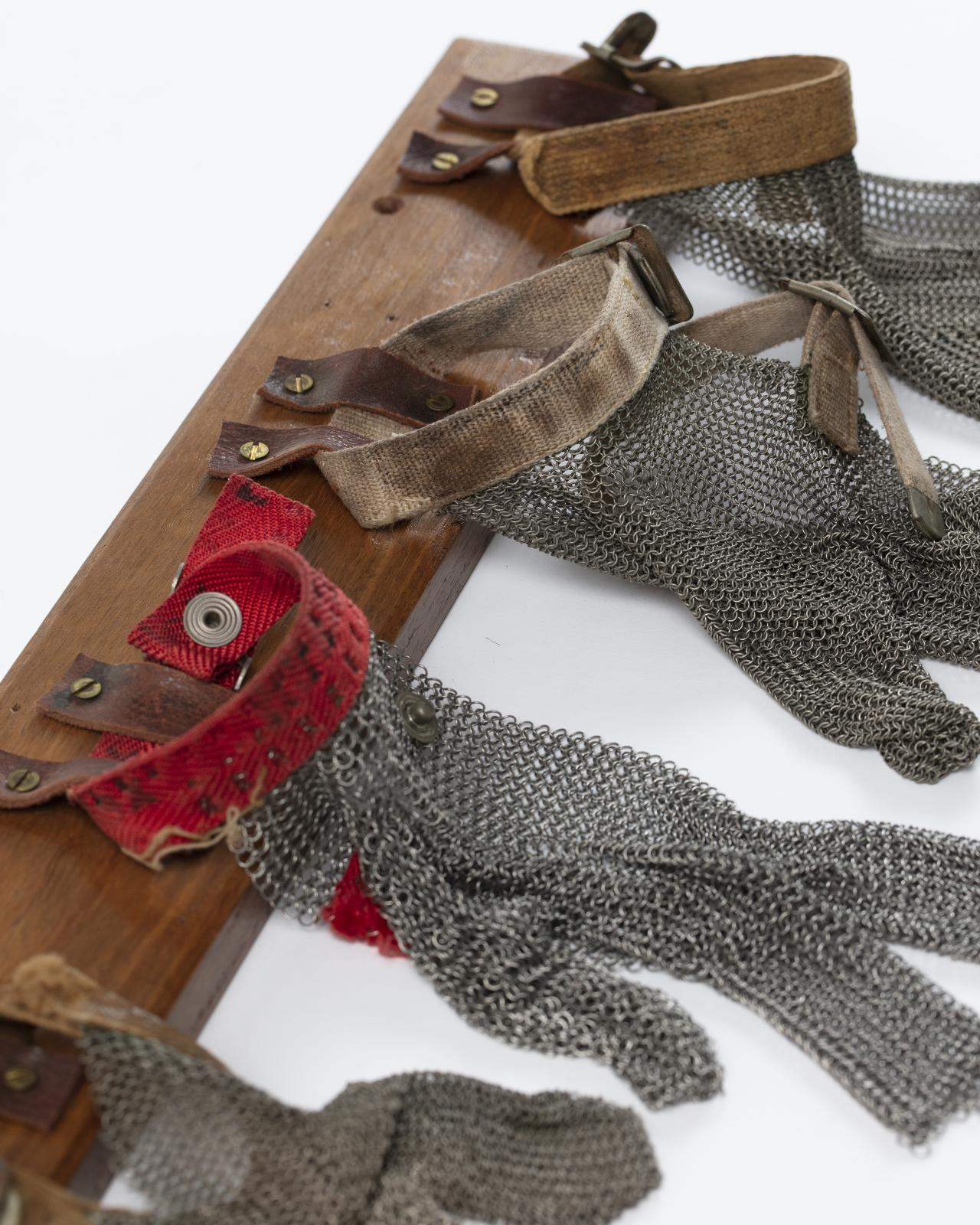 Chainmail gloves used by meatworkers at the Wyndham Meatworks. View from front left.