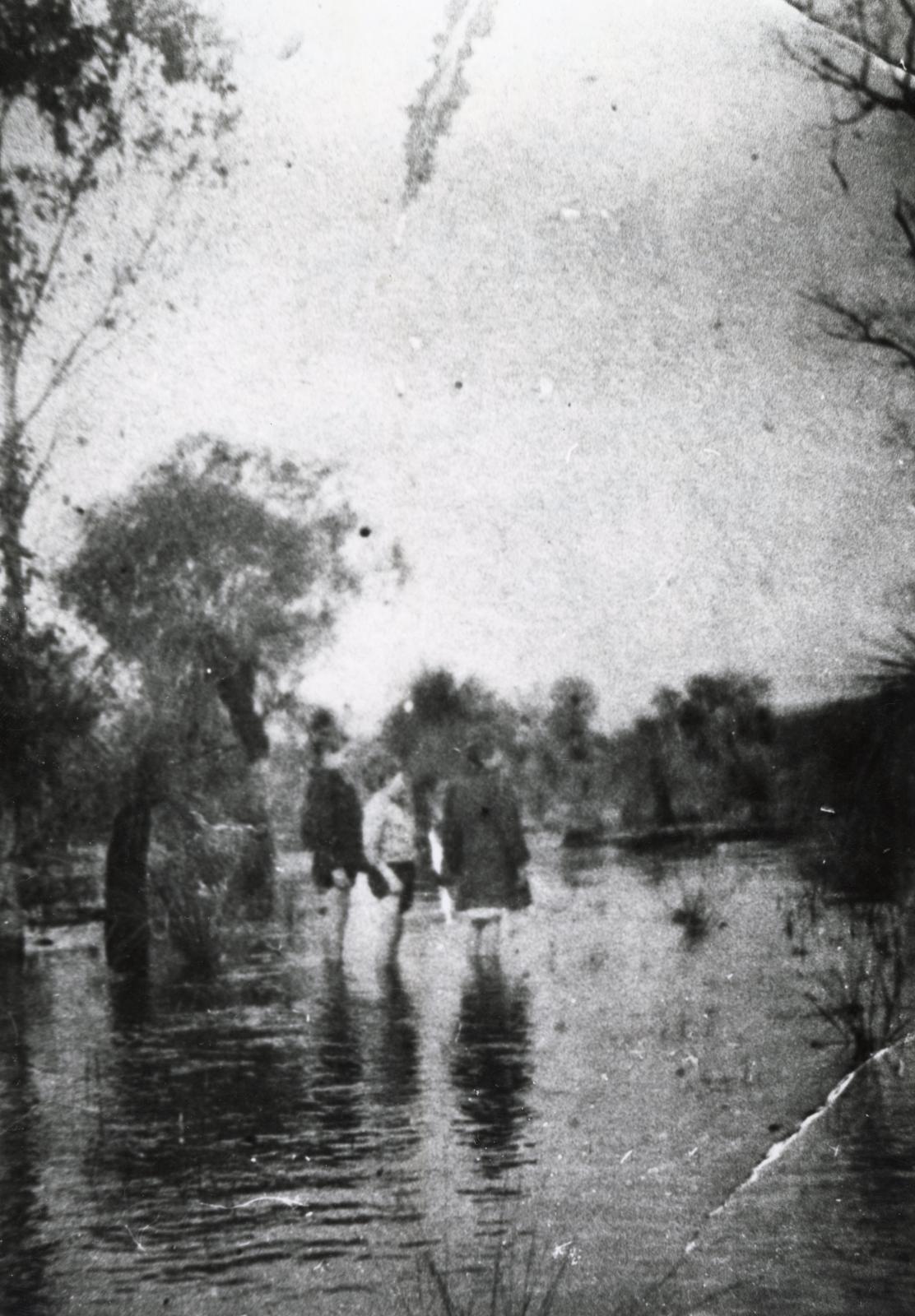 Three children playing in the flooded Southern River c.1915