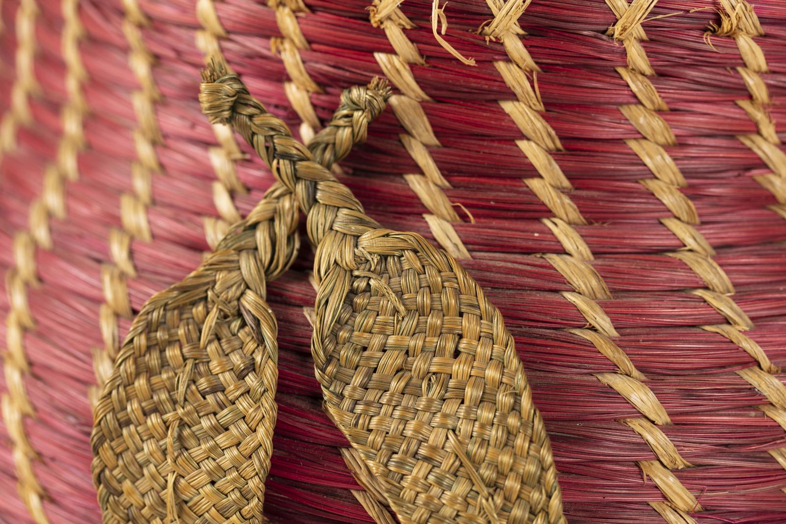 close up of woven leaves on woven basket