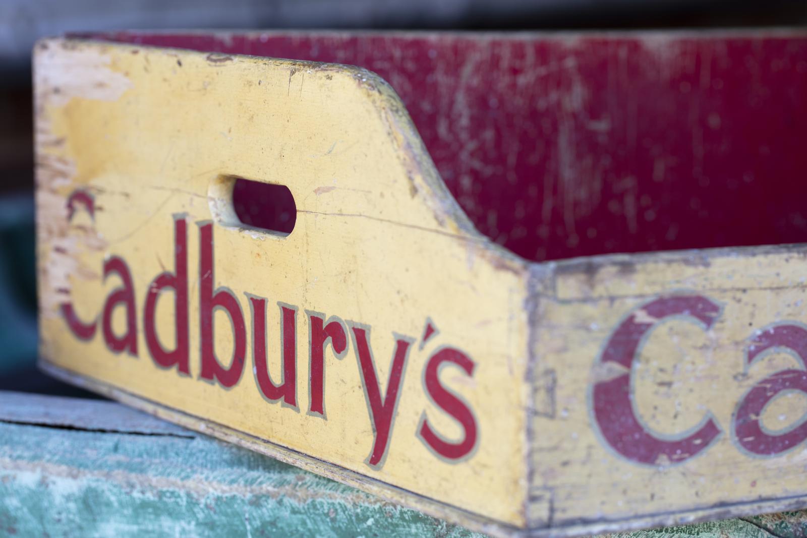 Red and yellow Cadbury's chocoloate tray (closeup view from front left)