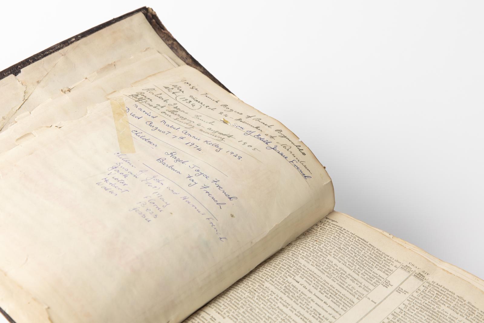 Pictorial Family Bible. View of bottom, right, and a page inside with hand written notes about a family