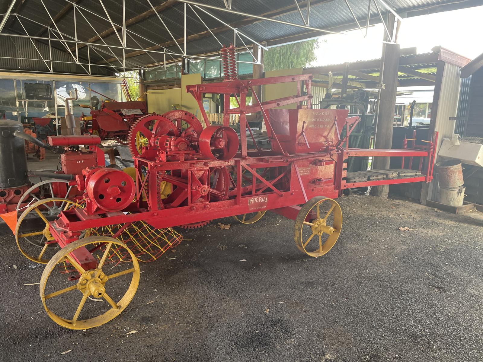 Side view of the Imperial Bagshaw Stationary Hay Baler