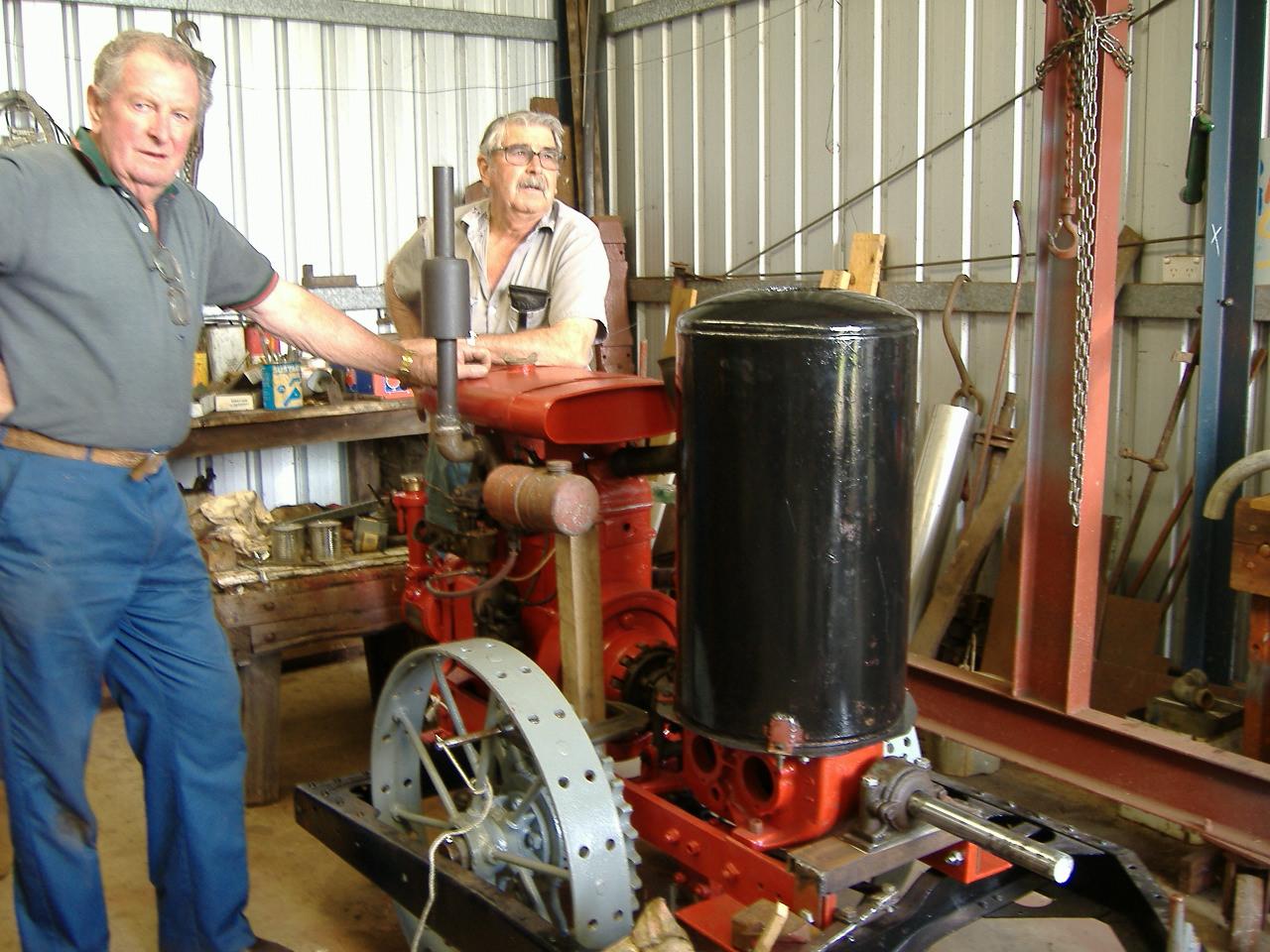 Ken Littlefair and John Harbeck with the restored Centaur tractor engine in the Museum shed