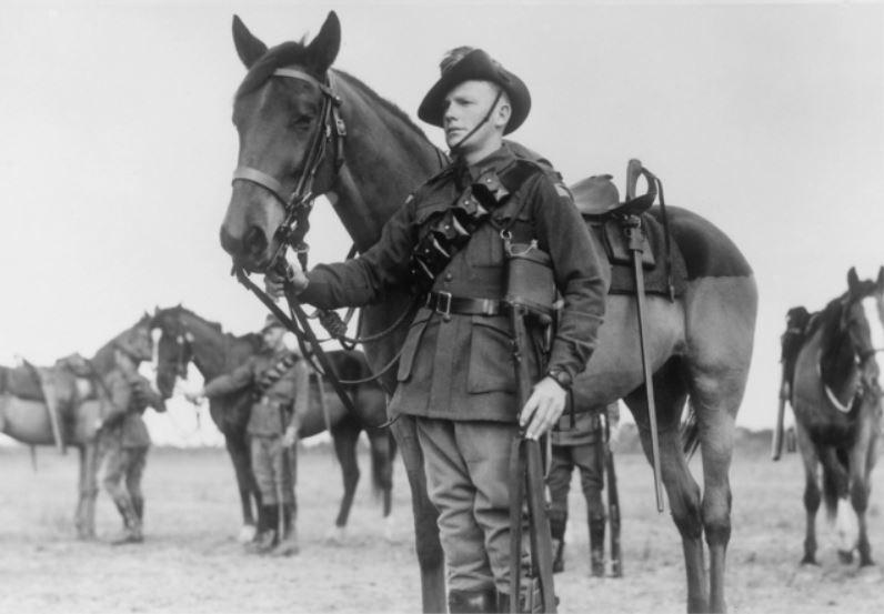 Trooper Keith Butcher with his horse in July 1943.